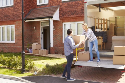 Student moving seasonal items into storage in Surrey Quays