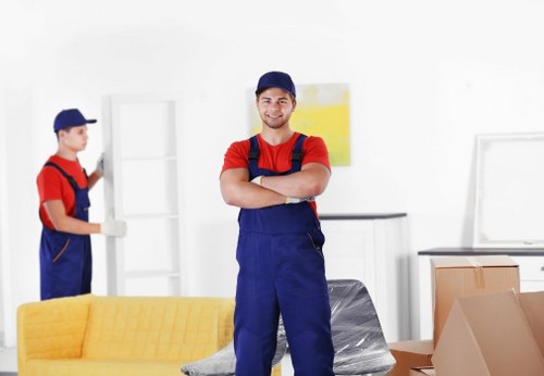 Flat removals planning in Surreyquays with packed boxes and moving equipment